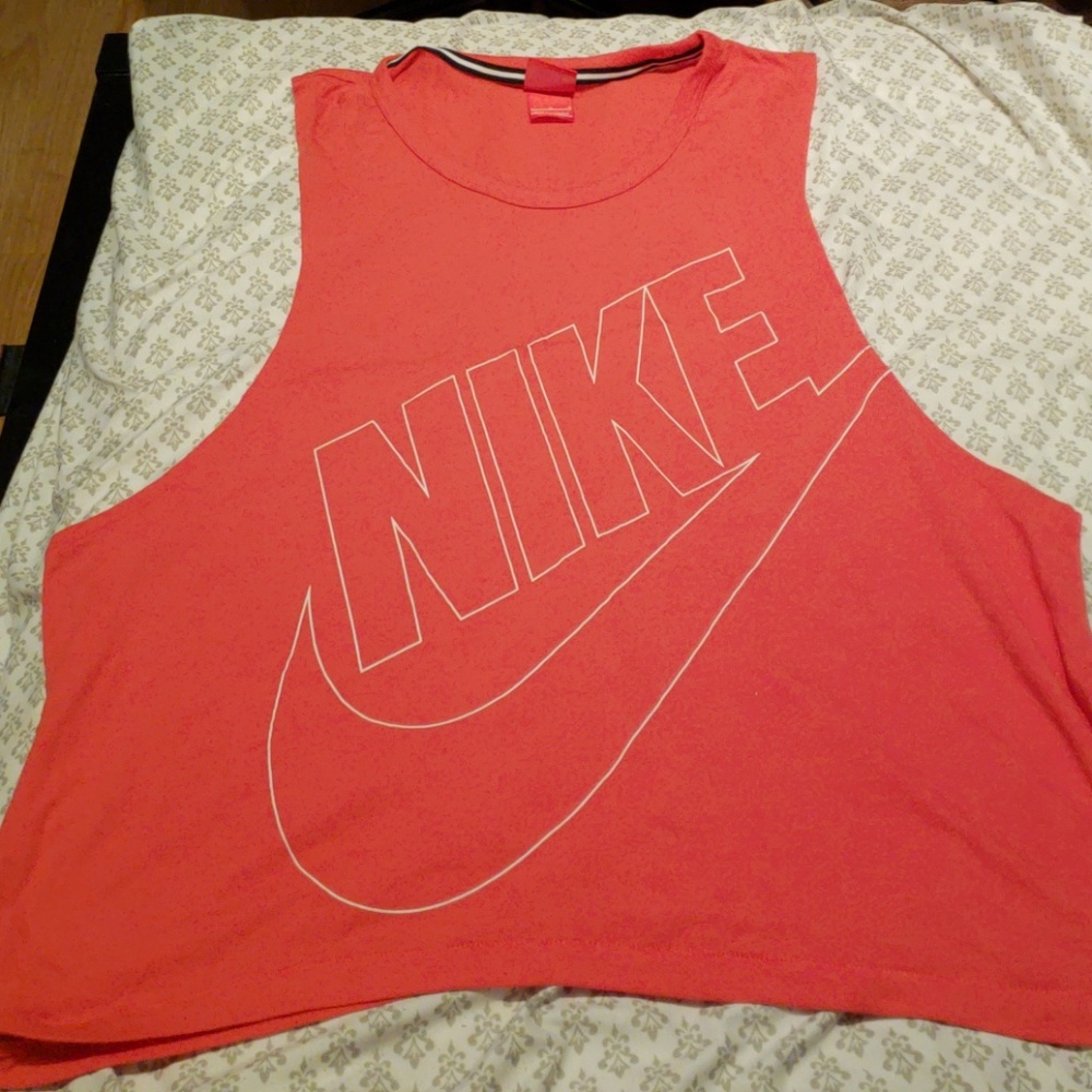 $5/20 Coral orange nike sleeveless shirt.